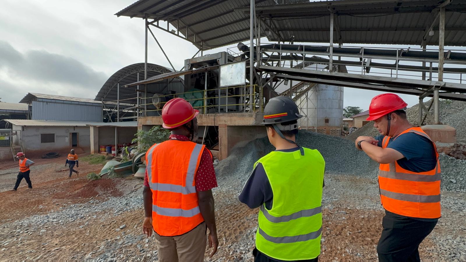 Group team inspecting a gold processing plant with international partners